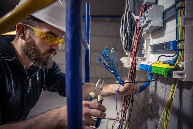 Electrician working on electrical wiring
